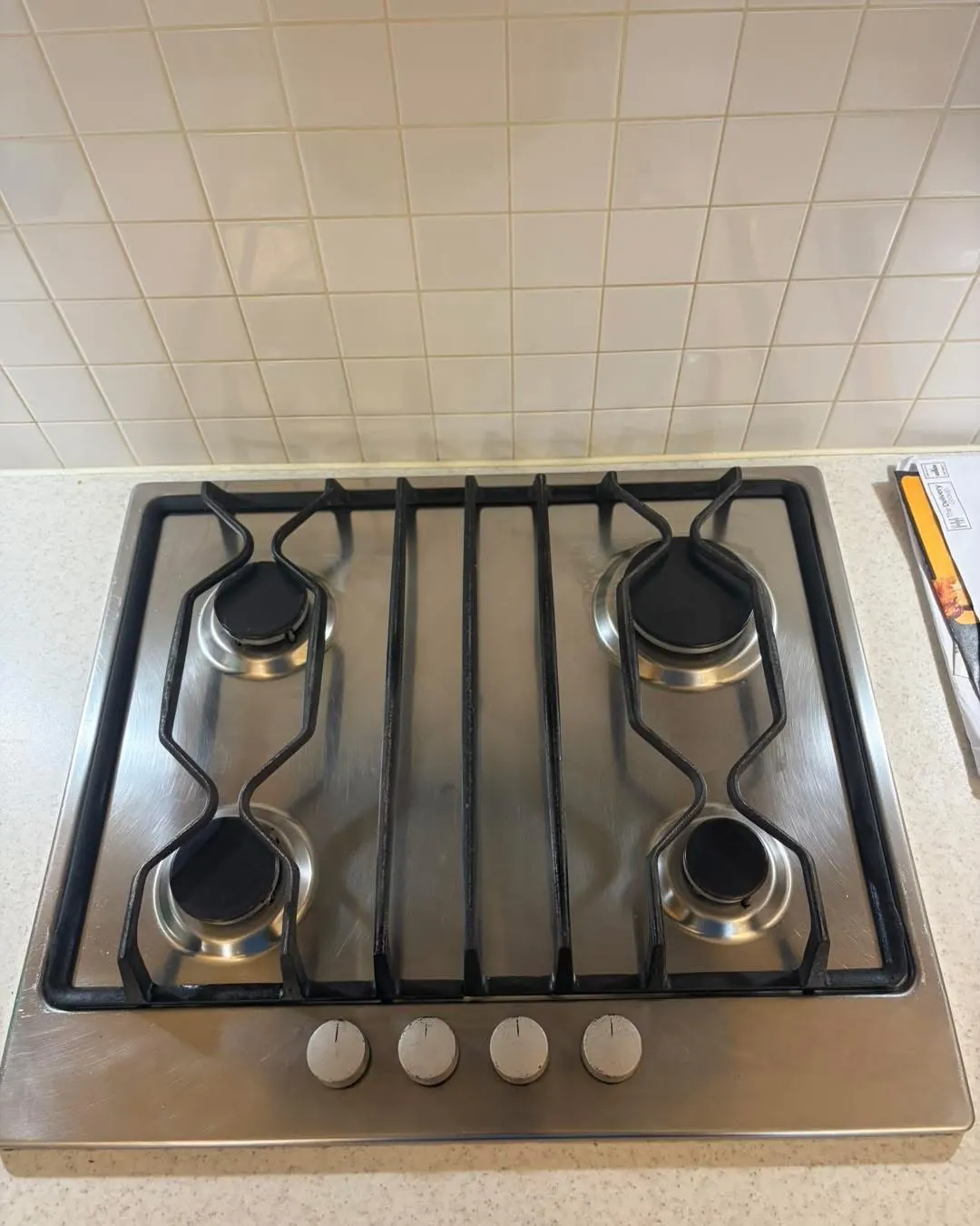 Stainless steel gas hob cleaned and polished